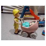 This image features a collection of various vintage and small toy figures