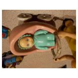 This image features a collection of various vintage and small toy figures