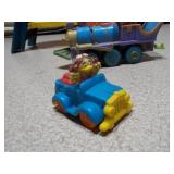 This image features a collection of various vintage and small toy figures