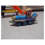 This image features a collection of various vintage and small toy figures