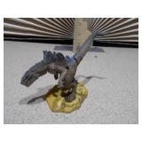 This image features a collection of various vintage and small toy figures