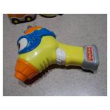 This image features a collection of assorted small plastic toys