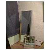 rectangular floor mirror with a metallic frame