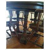 Round Wooden Pedestal Table With (2) Leaves and (4) Heavy Wood and Leather Chairs