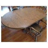 Round Wooden Pedestal Table With (2) Leaves and (4) Heavy Wood and Leather Chairs
