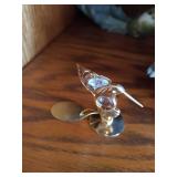 Middle Shelf of Bird Figurines, Bookends, Candy Dish and Suncatcher