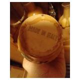 Bottom Shelf of Pottery