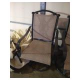 4 Brown Swiveling Patio Chairs with Covers