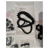 Collection of Black Gemstone and Glass Beads in Various Sizes and Shapes