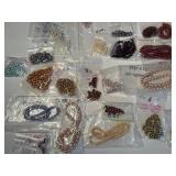 Large Collection of Assorted Loose Beads in Various Colors and Sizes
