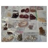Large Collection of Assorted Loose Beads in Various Colors and Sizes
