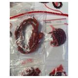 Collection of Red Glass, Stone, and Ceramic Beads Assorted Shapes and Sizes