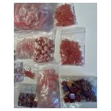 Collection of Assorted Pink and Red Gemstone Beads in Mixed Shapes and Sizes