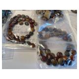 Assorted Collection of Semi-Precious Stone Beads and Bracelets in Various Shapes