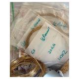 Collection of Gold-Filled Wire and Jewelry Findings in Storage Tins