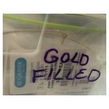 Collection of Gold-Filled Wire and Jewelry Findings in Storage Tins