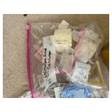 Collection of Gemstone Beads, Jewelry Findings, and Crafting Supplies in Bags and Box