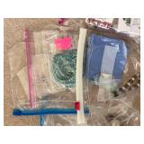 Collection of Gemstone Beads, Jewelry Findings, and Crafting Supplies in Bags and Box