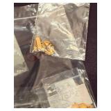 Large Assortment of Themed Gold Tone Metal Charms in Bags