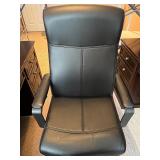 Black Adjustable Office Chair with Armrests and Rolling Base