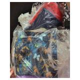 Collection of Assorted Fabric Remnants and Fat Quarters with Patterns