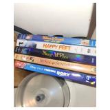 Collection of DVDs and Blu-rays including Finding Dory, Happy Feet, and Mystery Series