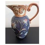 Vintage Embossed Floral Ceramic Pitcher with Scroll Handle
