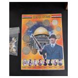 World Travel Collectibles Lot Including Iraqi Coins, Foreign Currency, Spoons, Figurines, and Wooden Display Rack