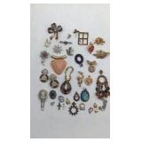 Assortment of Brooches and Necklace Pendants