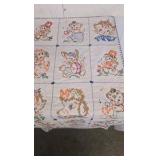 Vintage Baby Quilt with cross stitching animals.