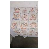 Vintage Baby Quilt with cross stitching animals.