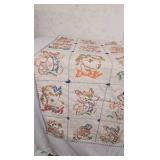 Vintage Baby Quilt with cross stitching animals.