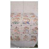 Vintage Baby Quilt with cross stitching animals.