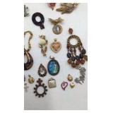 Assortment of Brooches and Necklace Pendants