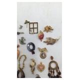 Assortment of Brooches and Necklace Pendants