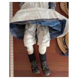 Doll With White Pinafore Dress And Two Straw Hats