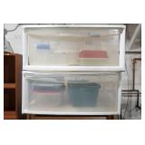 2 plastic drawer containers filled with plastic storage containers