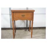 vintage Sears Kenmore sewing machine in cabinet
