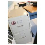 Rm 217 - Desk with computer riser, file cabinet, floor mat