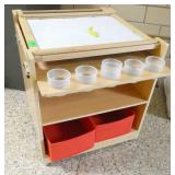 by Rm 110 - easel, play stand