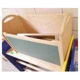 by Rm 110 - 2 portable storage units, a toy box, 3 chairs and a desk