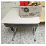 by Rm 110 - 2 portable storage units, a toy box, 3 chairs and a desk