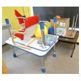 Rm 101A - 4 kids tables, 2 lounge chairs and misc contents