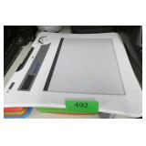 Rm 102 - 2 Shelves with a calculator, heater, bluetooth speaker, phone, tablet and more