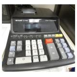 Rm 102 - 2 Shelves with a calculator, heater, bluetooth speaker, phone, tablet and more