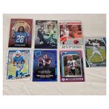 Lot of 7 Rookies and Inserts Football Cards Featuring Jahmyr Gibbs, Jaxon Smith-Njigba, Baker Mayfield, Trevor Lawrence, Deshaun Watson, and Jeremiah Trotter Jr.