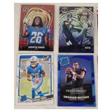 Lot of 7 Rookies and Inserts Football Cards Featuring Jahmyr Gibbs, Jaxon Smith-Njigba, Baker Mayfield, Trevor Lawrence, Deshaun Watson, and Jeremiah Trotter Jr.