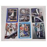 Lot of 6 Stephen Curry Basketball Cards Including Donruss Scoring Kings, Panini Dominance, and Mosaic Will to Win with Golden State Warriors Features
