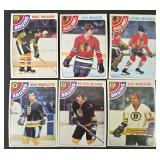 Vintage 1970s NHL Hockey Cards (Lot of 48) featuring Bruins, Sabres, North Stars, Penguins