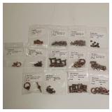 Lot of Antique copper alloy finings. 13 packages total.
